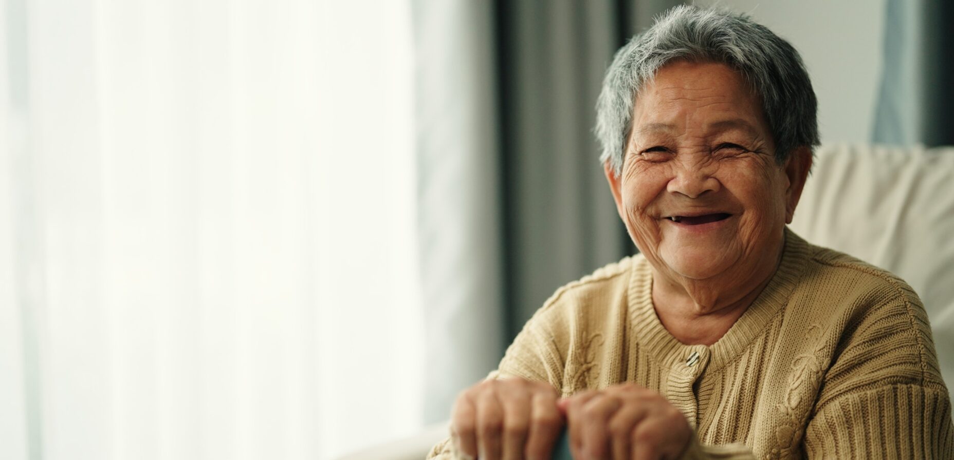 Elderly woman smiling at the camera for a portrait