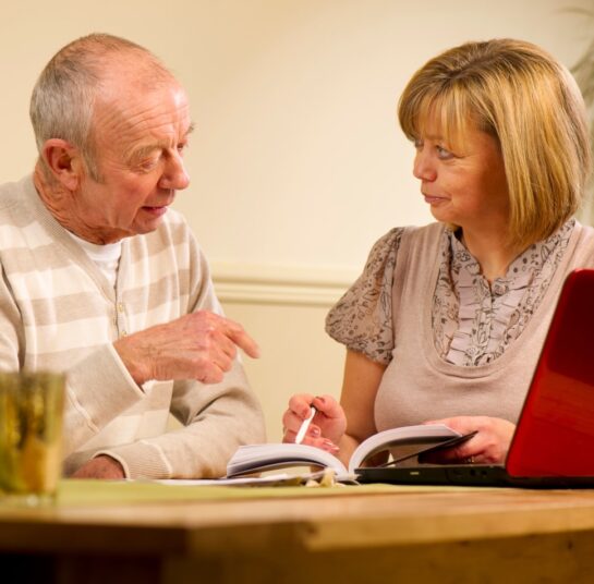 Man talking to a care worker about care options.